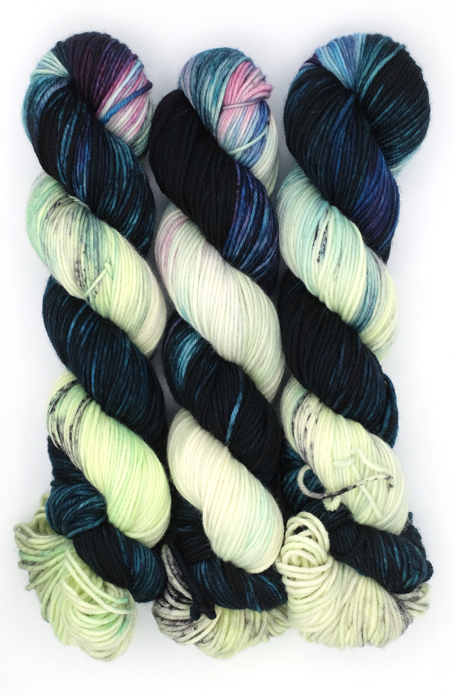 Multicolored yarn skeins on a white background