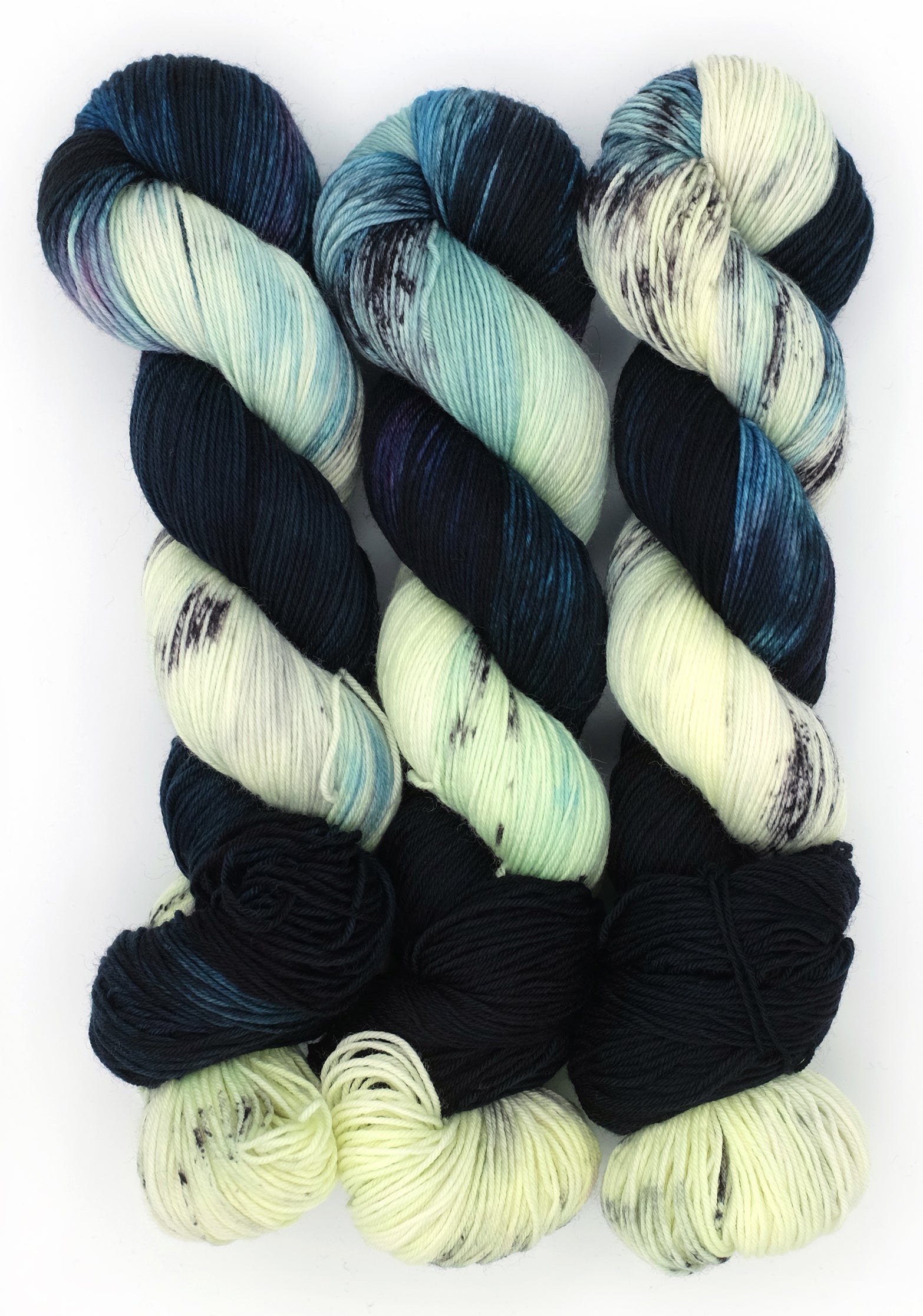 Multicolored yarn skeins on a white background