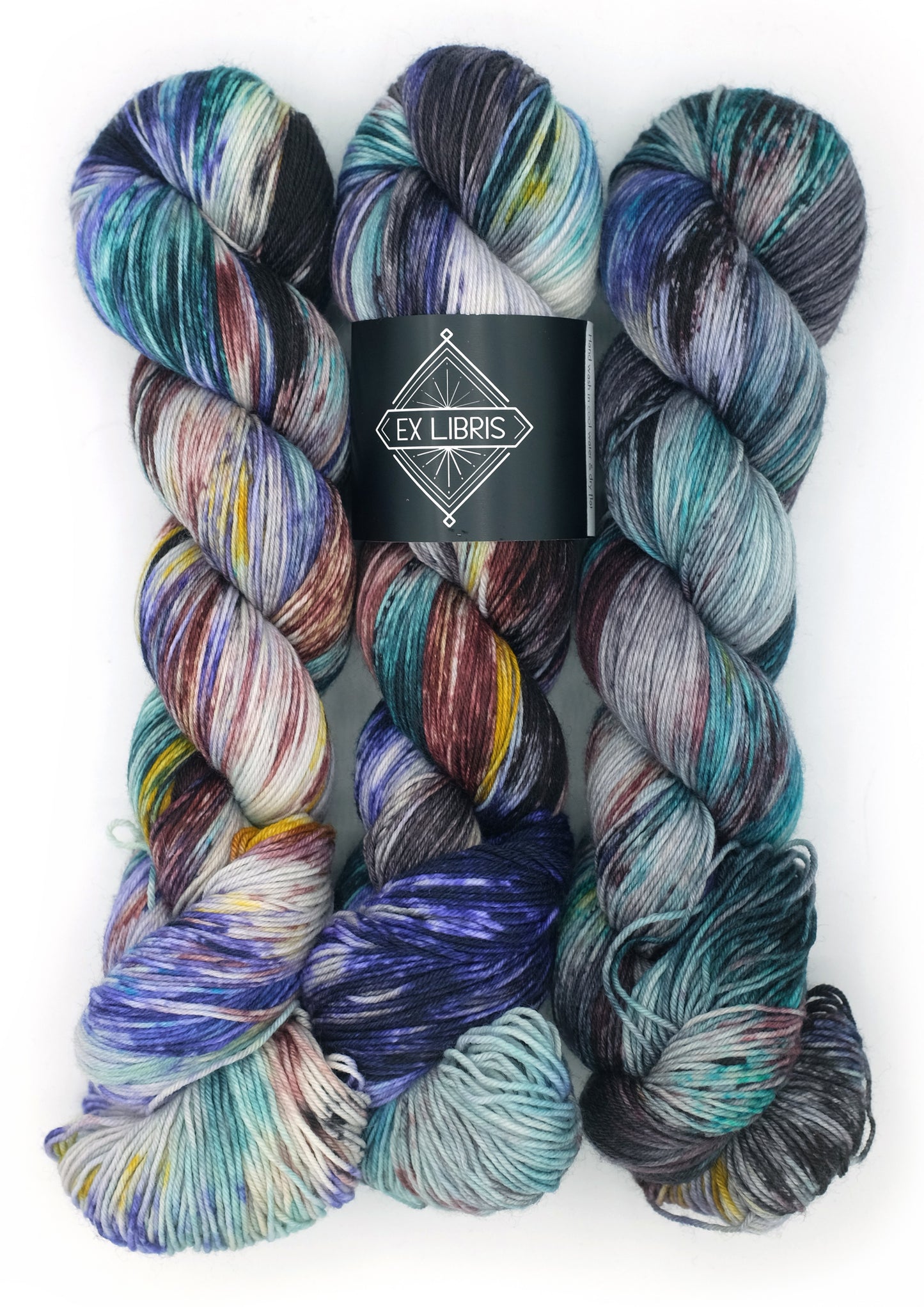 Multicolored yarn skeins with Ex Libris label on a white background