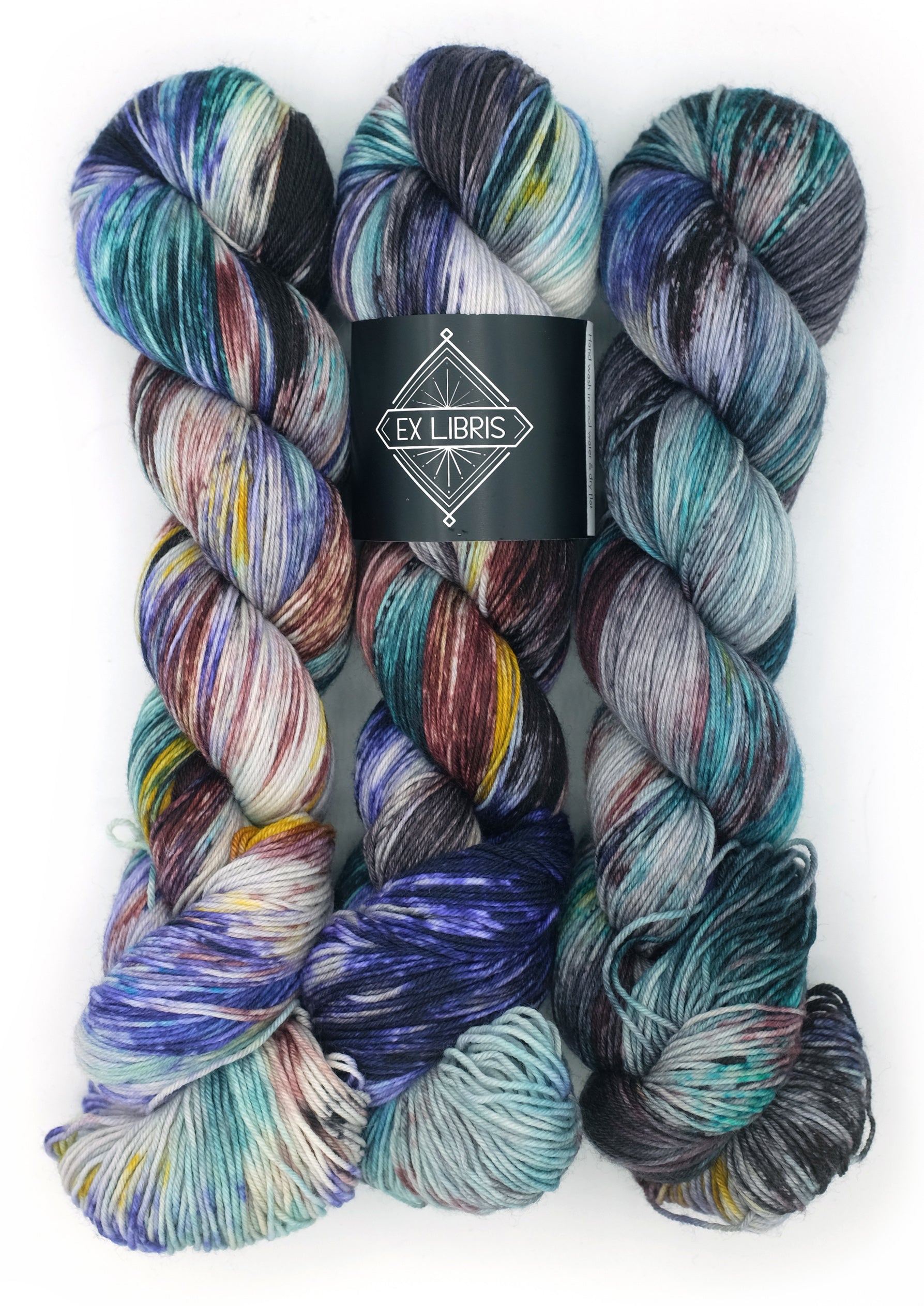 Multicolored yarn skeins with Ex Libris label on a white background