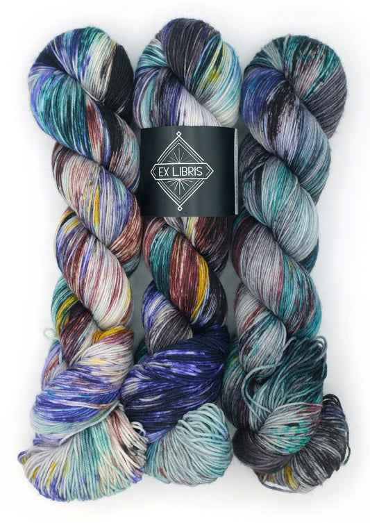 Multicolored yarn skeins with Ex Libris label on a white background